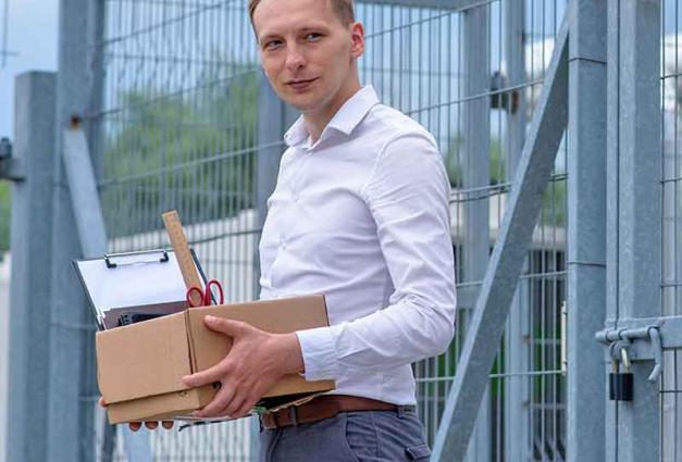 White Male prisoner holding box