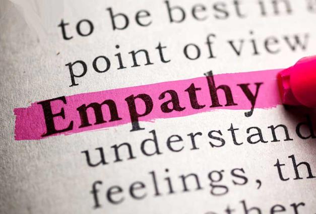 Person highlighting the word empathy