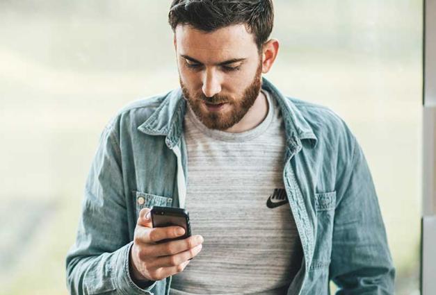 Man looking at mobile device