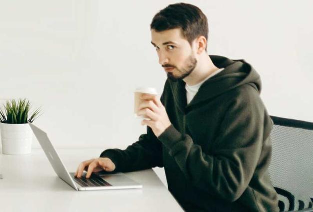 Young man sitting alone in a coffee shop 