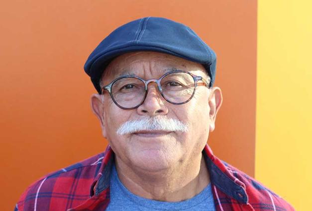 Photo of a content looking senior Hispanic man