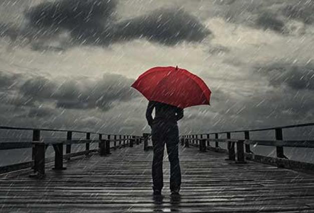 Red umbrella in a storm, a person, on a dock, standing silently