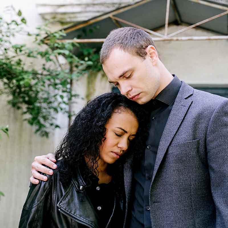Interracial couple embracing