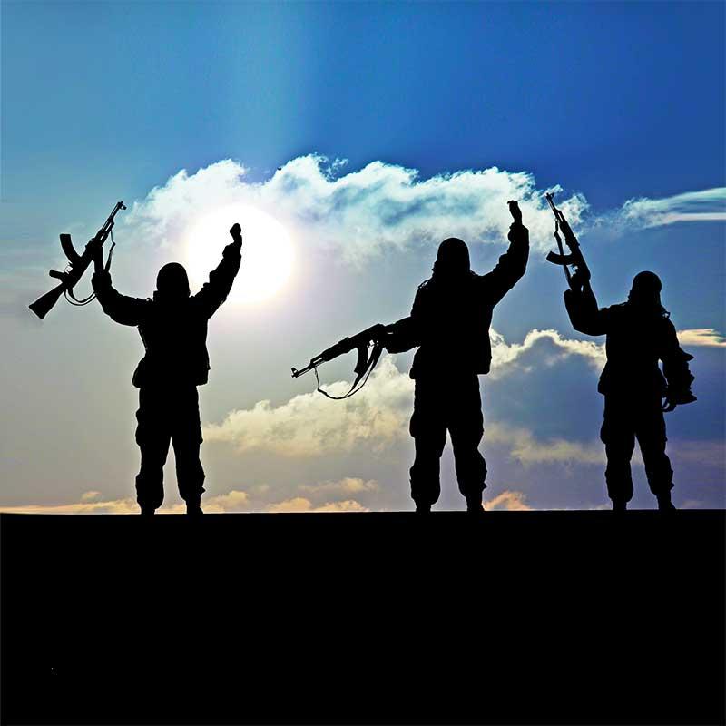 Silhouette of terorists against blue sky