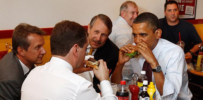 Image of President Obama eating a cheeseburger