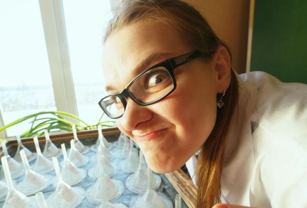 Young female scientist making a funny face
