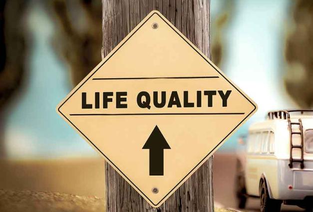Sign saying Life Quality with arrow pointing ahead