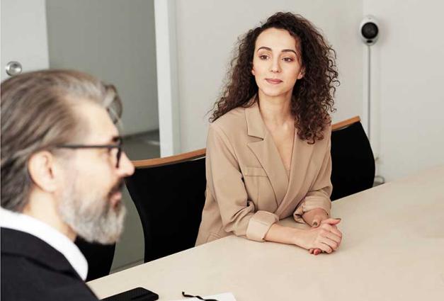 Woman and man at conference table