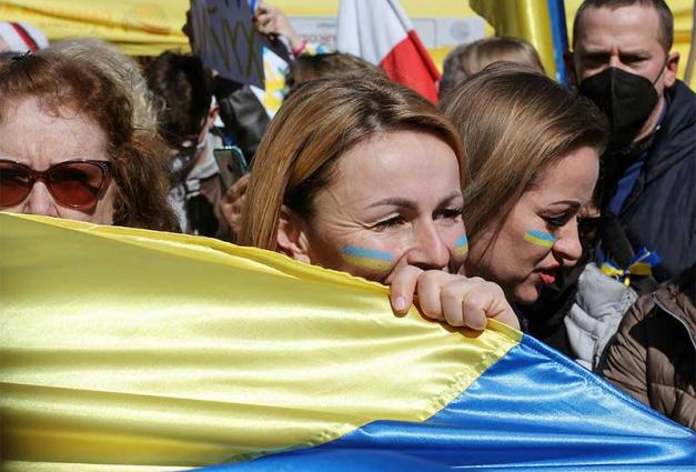 Women holding a Ukranian flag