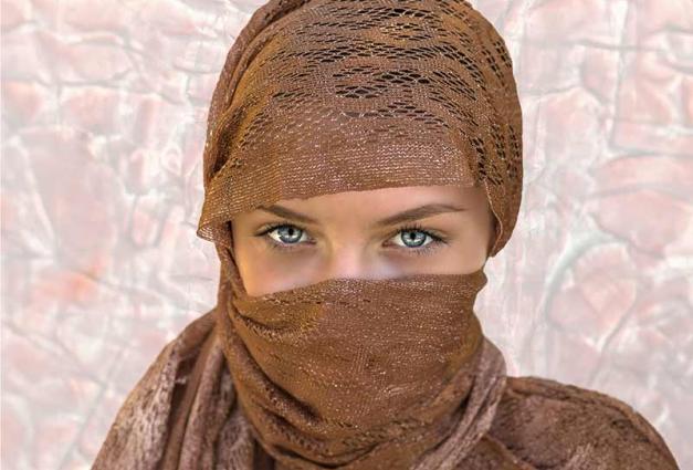 Woman with blue eyes and fair skin wearing a hijab
