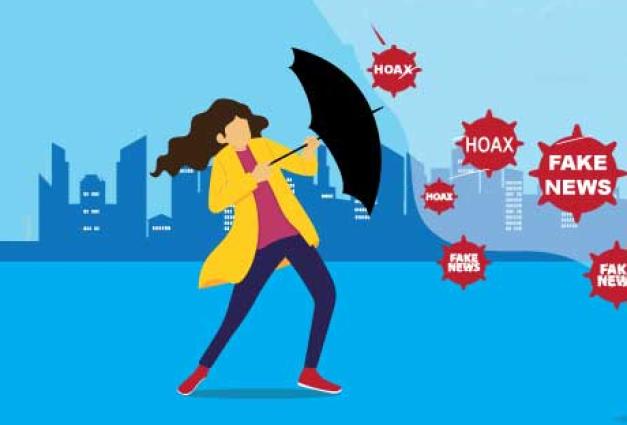 Businesswoman wearing raincoat opening an umbrella to protect herself from hoax and fake news