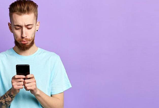 Young man looking at smartphone