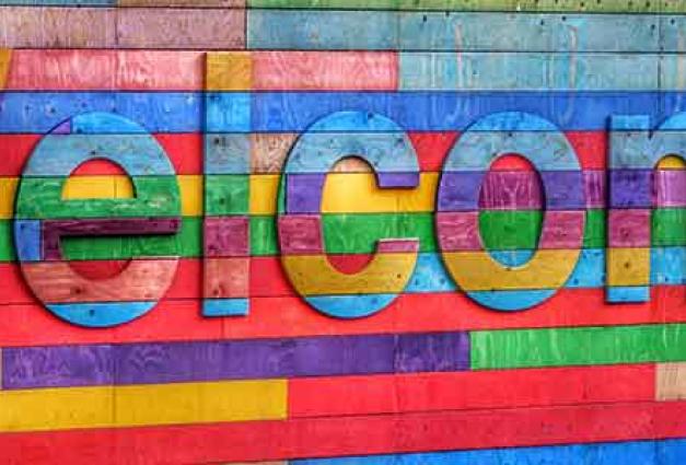 Image of a colourful welcome sign 