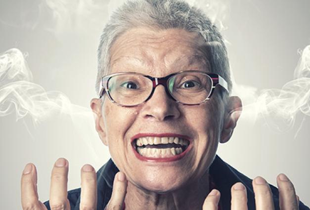 Angry Older woman with smoke coming out of her ears