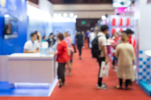 Blurred image of convention exhibitors