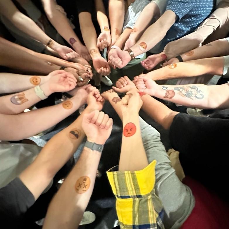 Temporary emoji tattoos to celebrate the collective experience at SISPP 2023! Image courtesy Hanh Annie Vu.